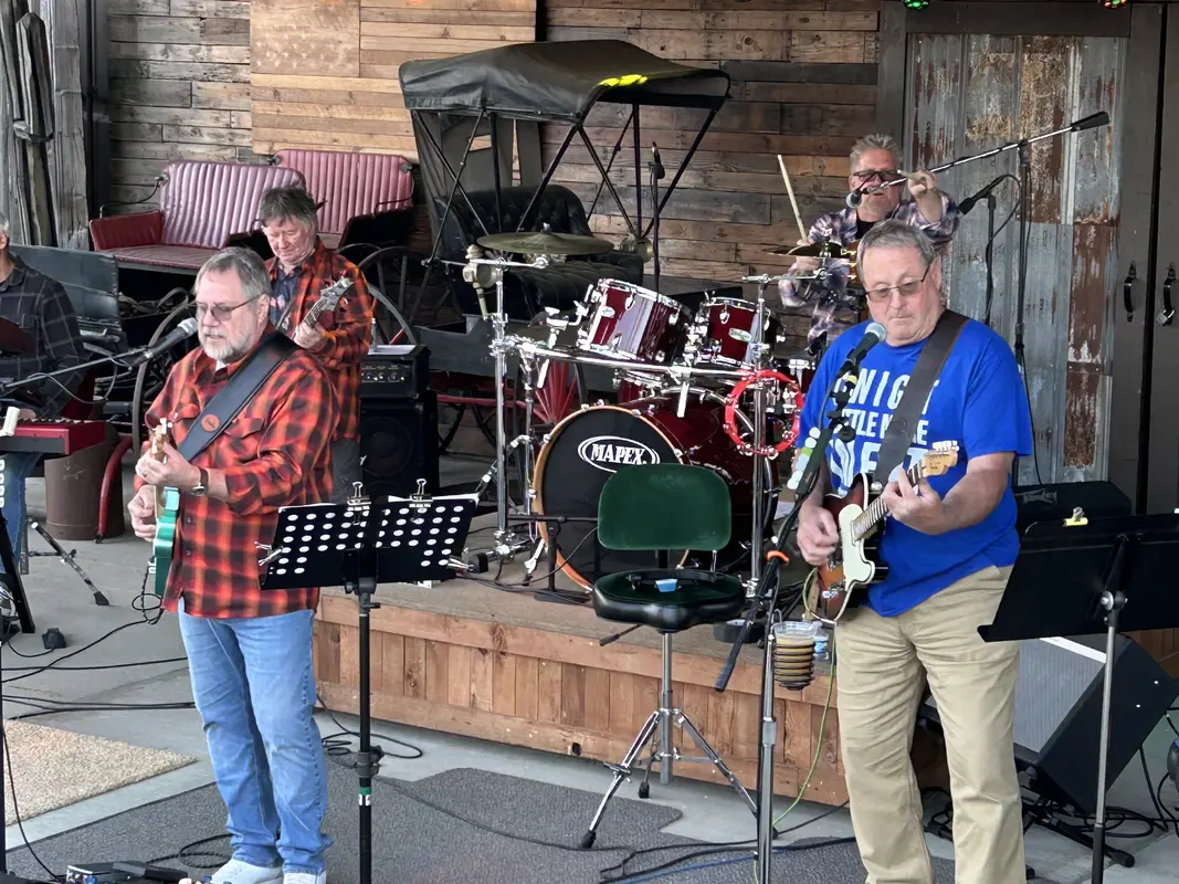 The full stage with two guitarists out front