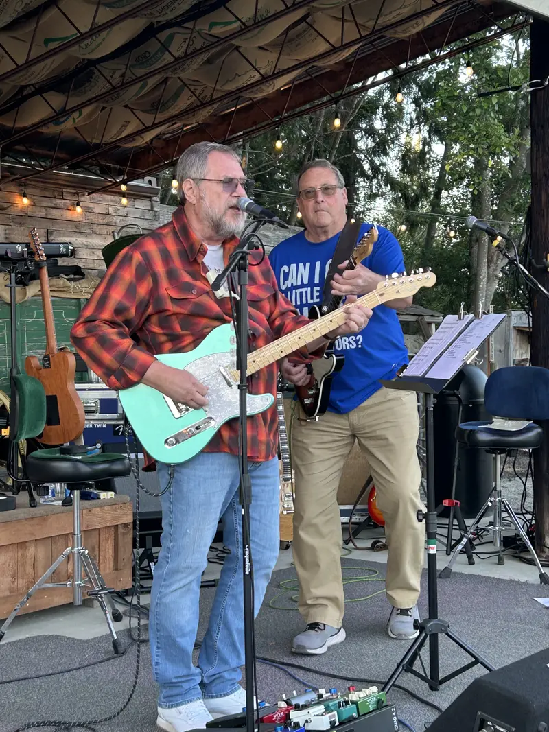 Two guitarists at the front of the stage